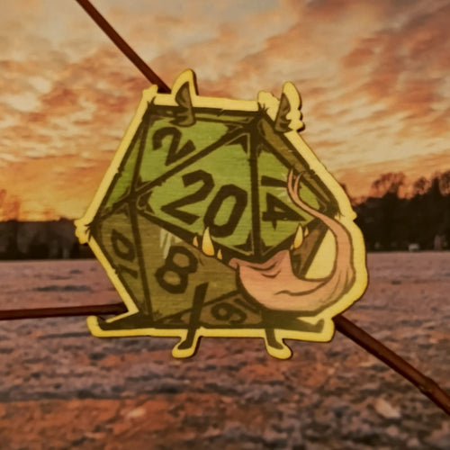 Brož s dvacetistěnným symbolem volby a náhody.